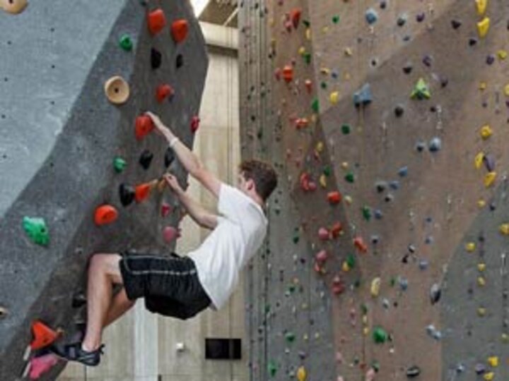 Student climbs in the Outdoor Adventures Center climbing gym